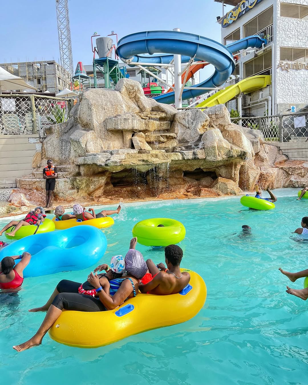 Visitors having fun in a pool at Aqualandia Waterpark and Pool in Central Park, Abuja.