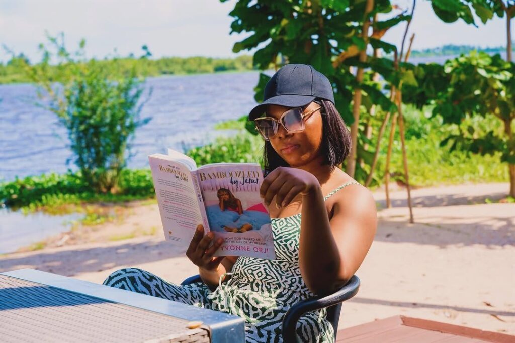 A guest reading a book at Sail Harbour Resort Community in Badagry.